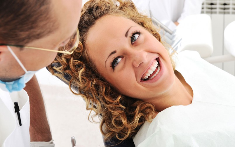 patient smiling after treatment dental clinic dubai