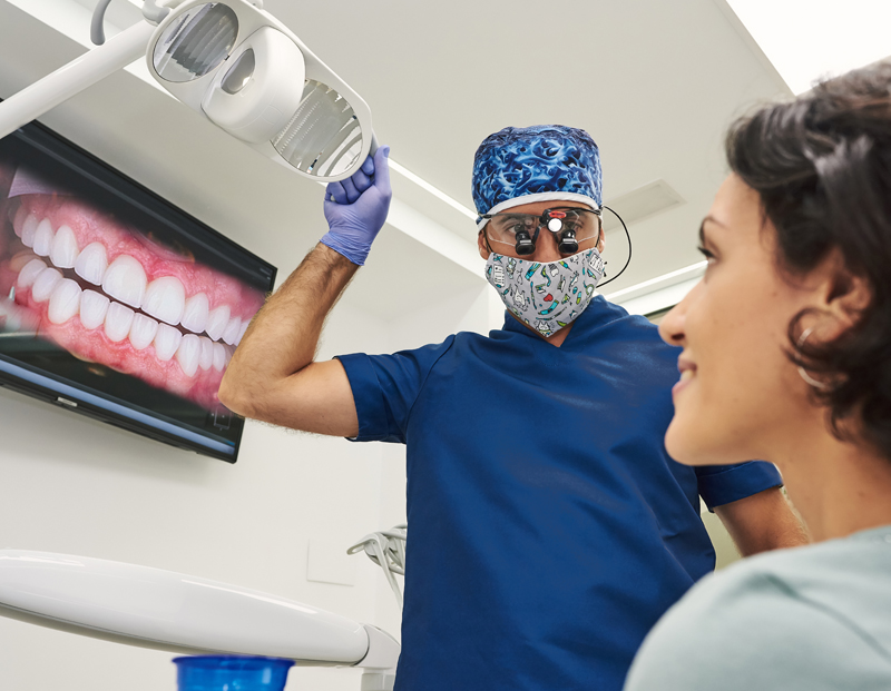 patient-looking-at-smile-preview-stock-photo