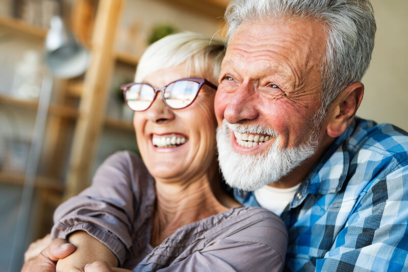 couple-smiling-after-dental-implant