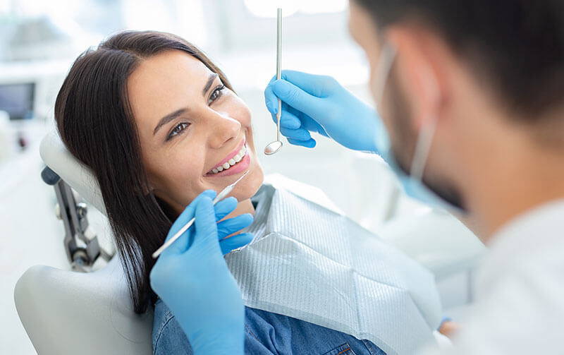 Patient on dental chair smiling