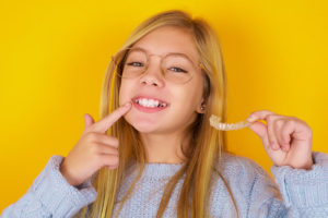 girl with invisalign product