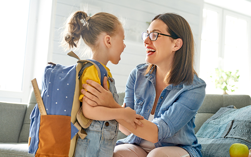 mom and kid smiling