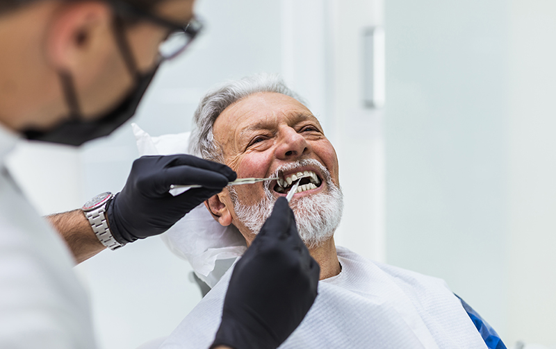Elder man under going regular dental checkup